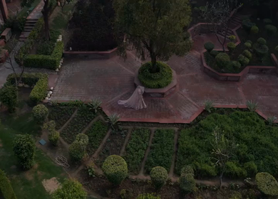 Aerial drone shot of an Indian bride posing gracefully during her wedding ceremony in India