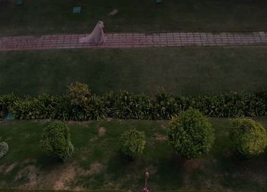 Aerial drone shot of an Indian bride posing gracefully during her wedding ceremony in India