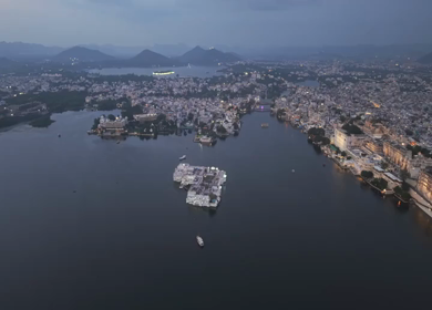 Aerial evening view of City Palace and Lake Pichola in Udaipur Rajasthan India