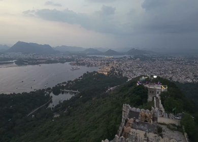 Aerial evening view of City Palace and Lake Pichola in Udaipur Rajasthan India