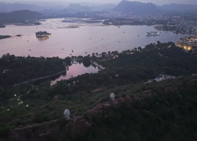 Aerial evening view of City Palace and Lake Pichola in Udaipur Rajasthan India
