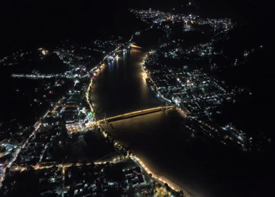 Aerial night shot of Janki Setu bridge over Ganges River in Rishikesh India
