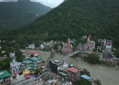 Aerial shot of Bajrang Setu suspension bridge over Ganges River in Rishikesh India