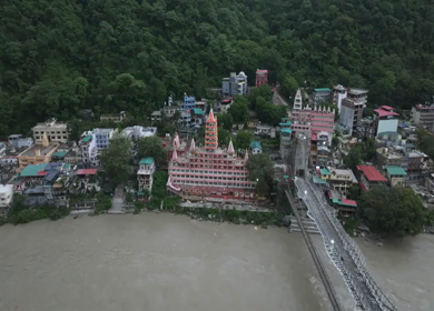 Aerial shot of Bajrang Setu suspension bridge over Ganges River in Rishikesh India