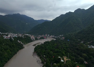 Aerial shot of Bajrang Setu suspension bridge over Ganges River in Rishikesh India