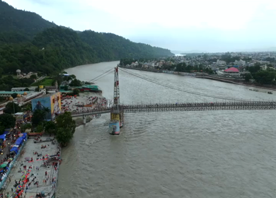 Aerial shot of Janki Setu suspension bridge over Ganges River in Rishikesh India