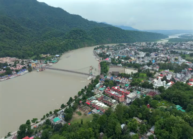 Aerial shot of Janki Setu suspension bridge over Ganges River in Rishikesh India