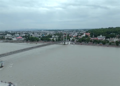 Aerial shot of Janki Setu suspension bridge over Ganges River in Rishikesh India