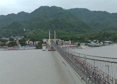 Aerial shot of Janki Setu suspension bridge over Ganges River in Rishikesh India