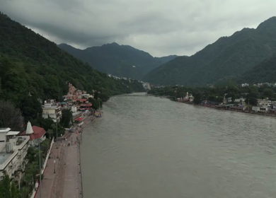Aerial shot of Ram Jhula suspension bridge over Ganges River in Rishikesh India
