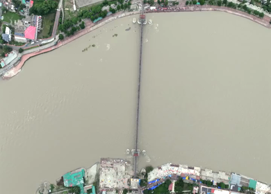 Aerial shot of Ram Jhula suspension bridge over Ganges River in Rishikesh India