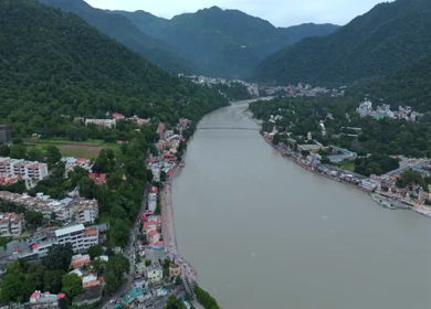 Aerial shot of Ram Jhula suspension bridge over Ganges River in Rishikesh India