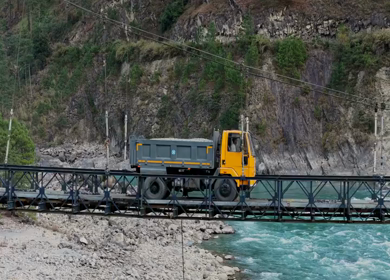 Aerial shot of Truck Crossing Bridge over Lohit River in Kaho Village Arunachal Pradesh India