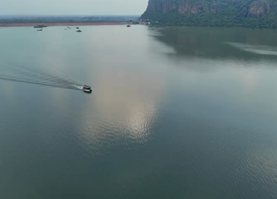 Aerial shot of a boat moving across calm river in Rohtas Bihar India