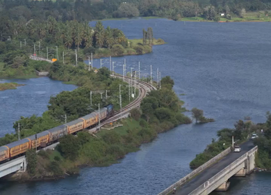 Aerial shot of train running at Maravanthe near Kundapura Karnataka India