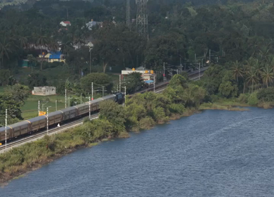 Aerial shot of train running at Maravanthe near Kundapura Karnataka India