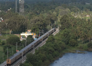 Aerial shot of train running at Maravanthe near Kundapura Karnataka India