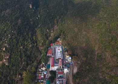 Aerial view of Marudhamalai Temple and winding hill roads in Coimbatore Tamil Nadu