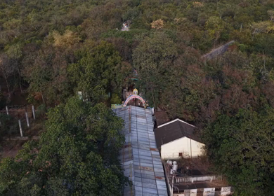 Aerial view of Marudhamalai Temple and winding hill roads in Coimbatore Tamil Nadu