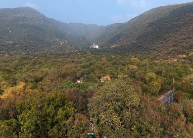 Aerial view of Marudhamalai Temple and winding hill roads in Coimbatore Tamil Nadu