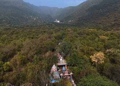 Aerial view of Marudhamalai Temple and winding hill roads in Coimbatore Tamil Nadu