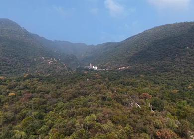 Aerial view of Marudhamalai Temple and winding hill roads in Coimbatore Tamil Nadu