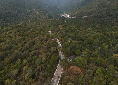 Aerial view of Marudhamalai Temple and winding hill roads in Coimbatore Tamil Nadu
