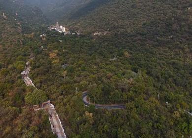 Aerial view of Marudhamalai Temple and winding hill roads in Coimbatore Tamil Nadu