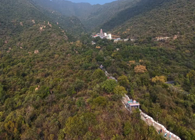 Aerial view of Marudhamalai Temple and winding hill roads in Coimbatore Tamil Nadu