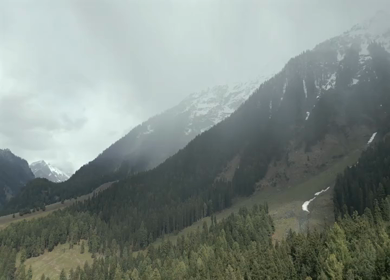 Aerial view of Pahalgam pine forest and Himalayan mountains in Kashmir India