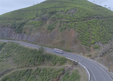 Aerial view of winding road through tea plantations in Munnar Kerala India