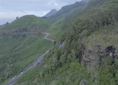 Aerial view of winding road through tea plantations in Munnar Kerala India