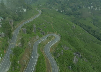Aerial view of winding road through tea plantations in Munnar Kerala India