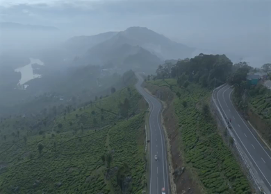 Aerial view of winding road through tea plantations in Munnar Kerala India