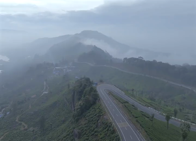 Aerial view of winding road through tea plantations in Munnar Kerala India