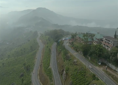 Aerial view of winding road through tea plantations in Munnar Kerala India