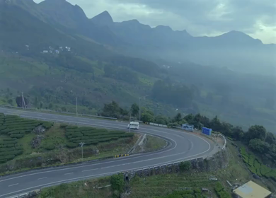 Aerial view of winding road through tea plantations in Munnar Kerala India