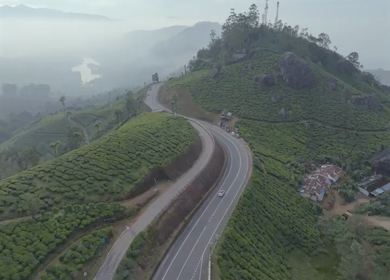 Aerial view of winding road through tea plantations in Munnar Kerala India