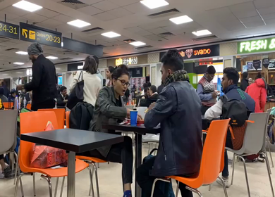 A timelapse shot of a people eating food at the New Delhi, Airport
