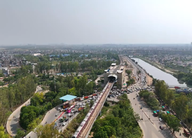 An Aerial Shot of Delhi Metro at Kalindi Kunj Bridge in Delhi, NCR, India