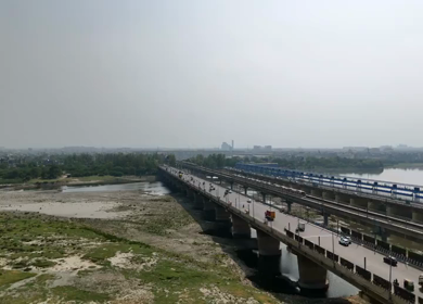 An Aerial Shot of Delhi Metro at Kalindi Kunj Bridge in Delhi, NCR, India