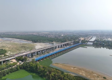 An Aerial Shot of Delhi Metro at Kalindi Kunj Bridge in Delhi, NCR, India