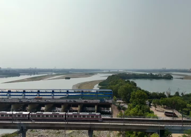An Aerial Shot of Delhi Metro at Kalindi Kunj Bridge in Delhi, NCR, India