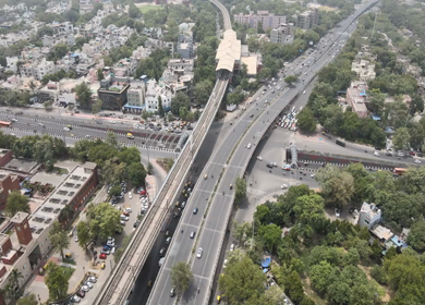 An Aerial Shot of Delhi Metro and Traffic movement at Moolchand Flyover in New Delhi,India