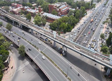 An Aerial Shot of Delhi Metro and Traffic movement at Moolchand Flyover in New Delhi,India