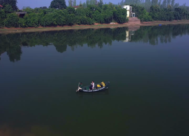 An Aerial Shot of a tourist enjoying boat ride in Tendu Leaf Jungle Resort in Madhya Pradesh