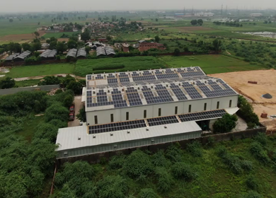 An Aerial Shot of Ecology solar power station panels in the fields 