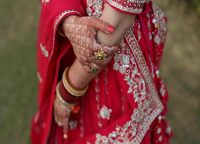 A Shot of an Indian Bride showing her Bridal Jewellery at her Indian Wedding in New Delhi,India
