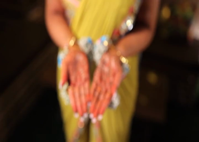 A Shot of Indian Bride showing Mehndi in her Hands at her Indian Wedding in New Delhi, India