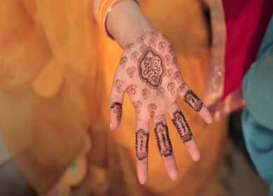 A Shot of Indian Bride showing Mehndi in her Hands at her Indian Wedding in New Delhi, India